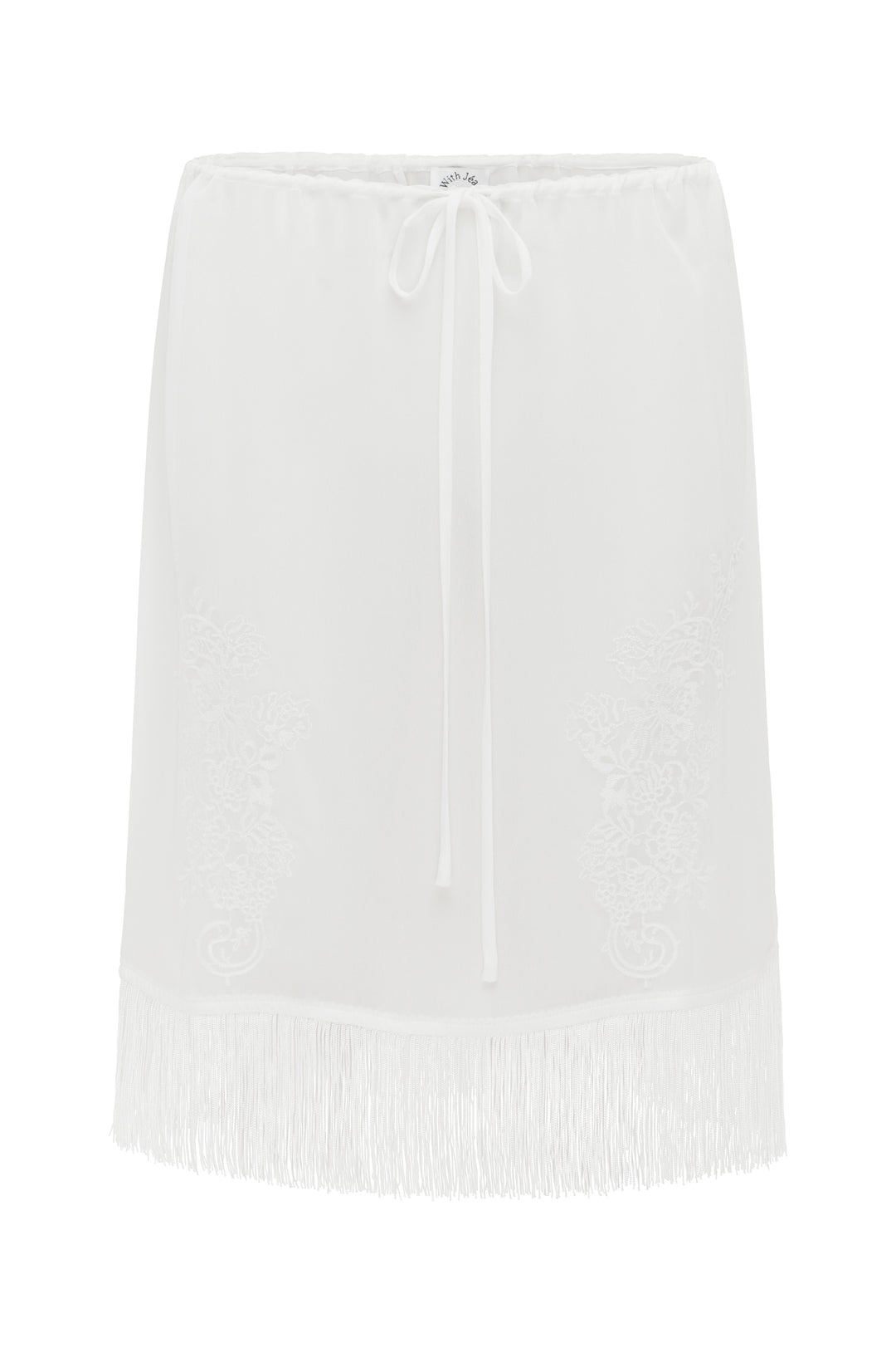 White low-rise skirt with an adjustable drawstring waist, delicate floral embroidery, and a long fringe hemline.