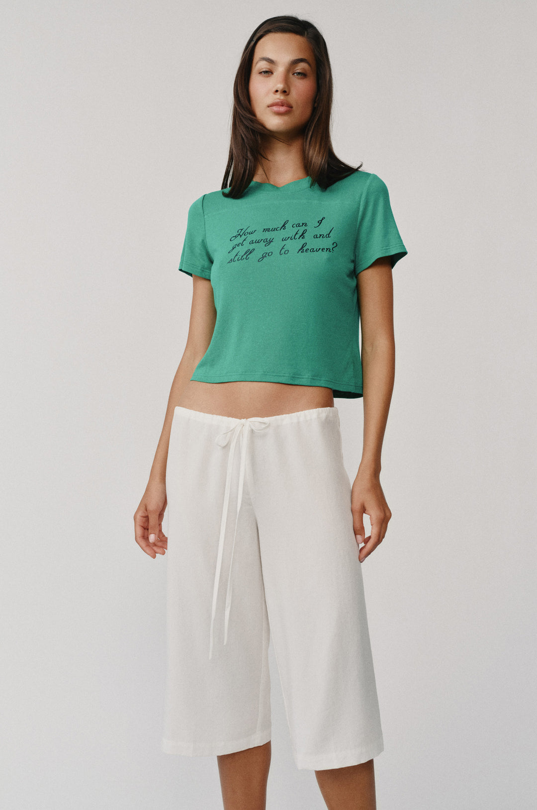 White Arden Capri Pant with adjustable tie waistband, worn by a model.