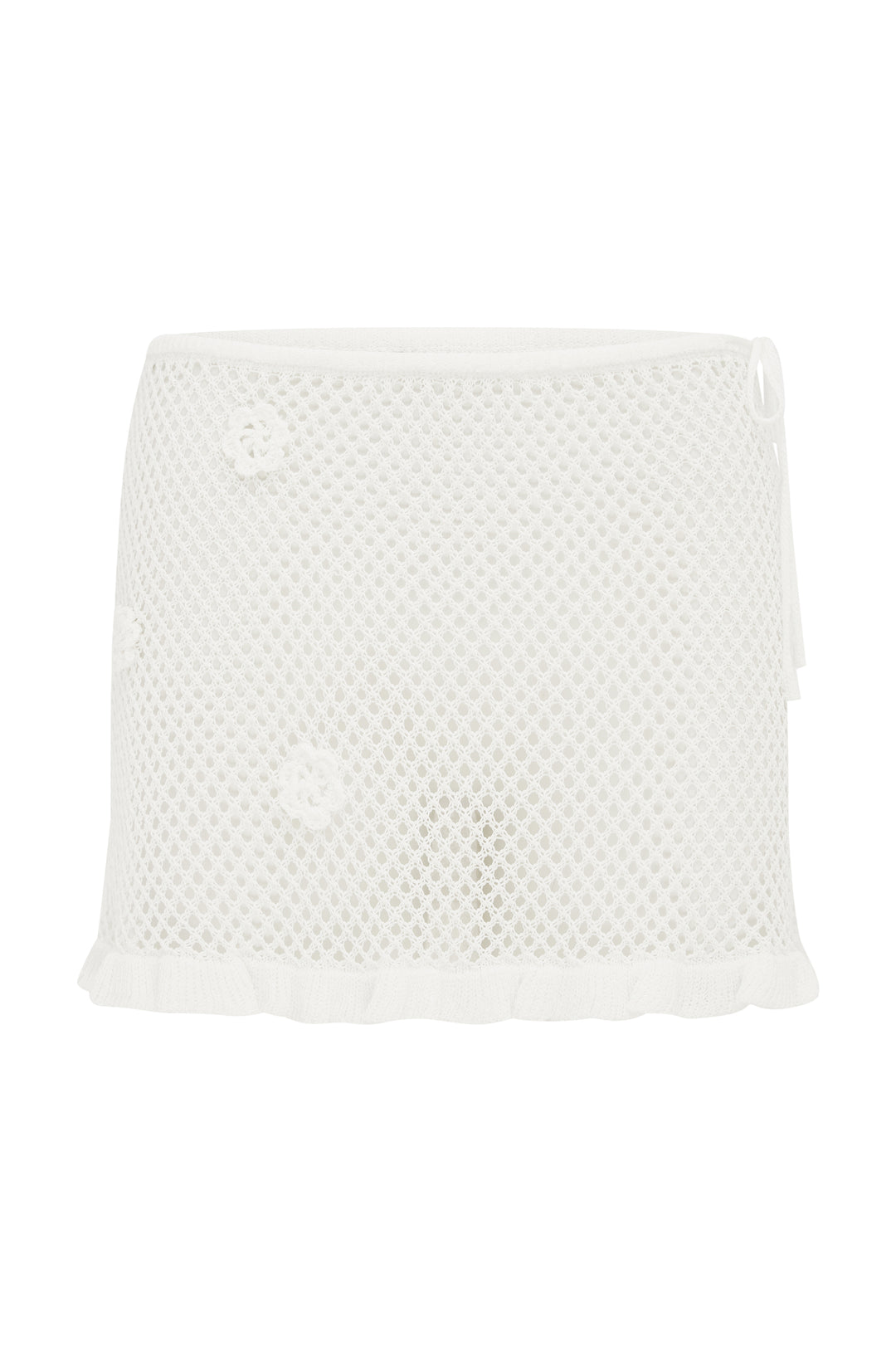 White knitted Aria mini skirt with floral appliques, tie waistband, and ruffled hem.