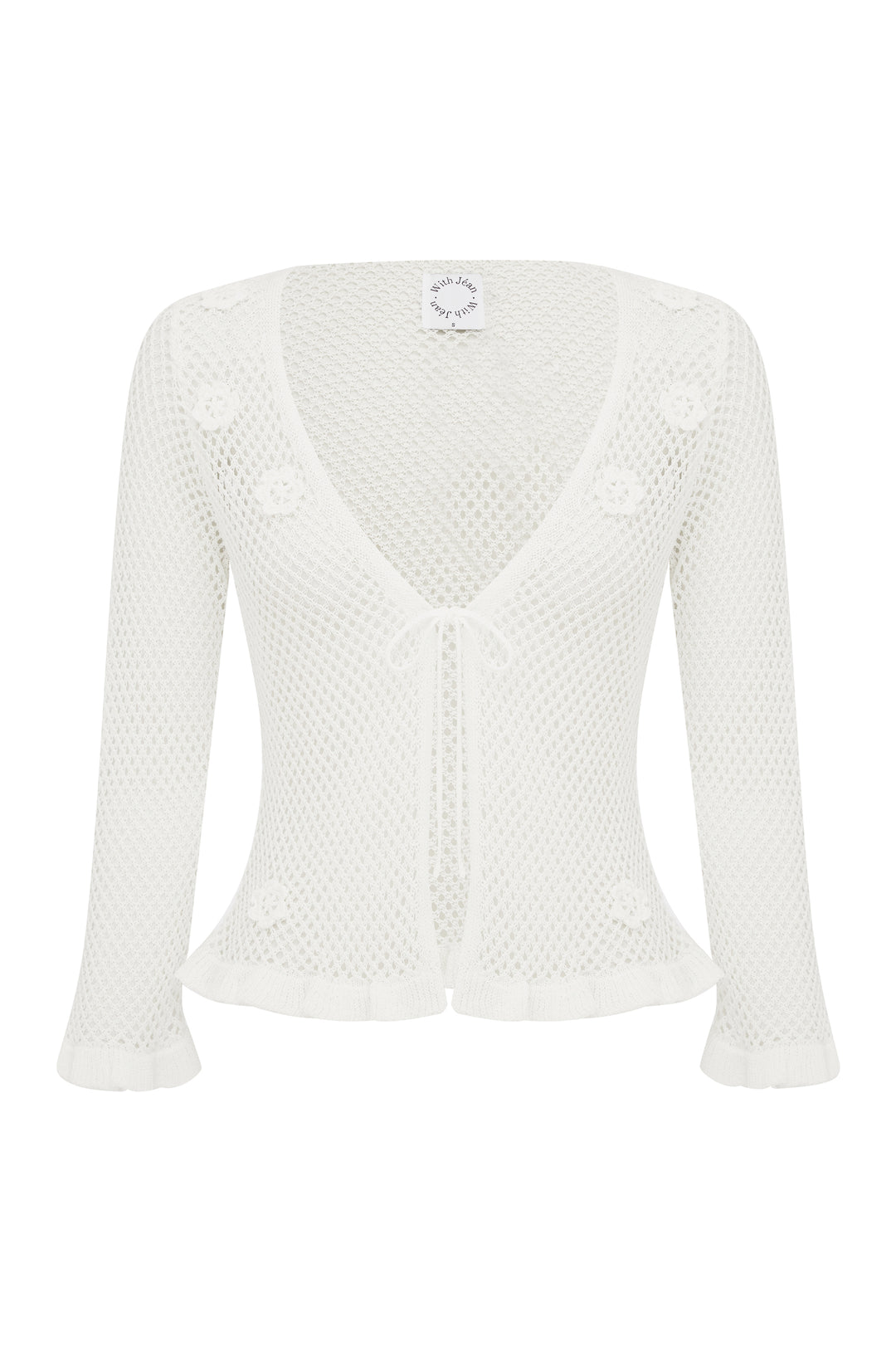 White knitted Aria Top with 3/4 sleeves, floral appliques, front tie, and ruffled hem.