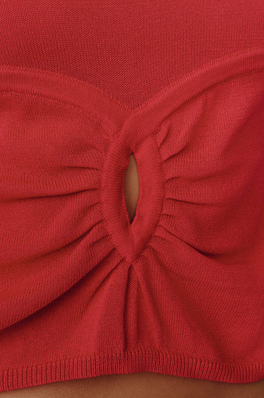 Close-up of a red knit Avery top featuring a gathered keyhole cut-out detail at the front.