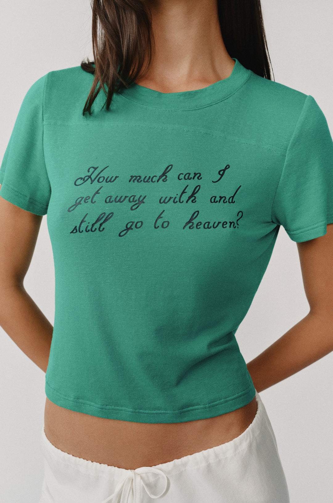 Ellie Tee in emerald green with "How much can I get away with and still go to heaven?" text.