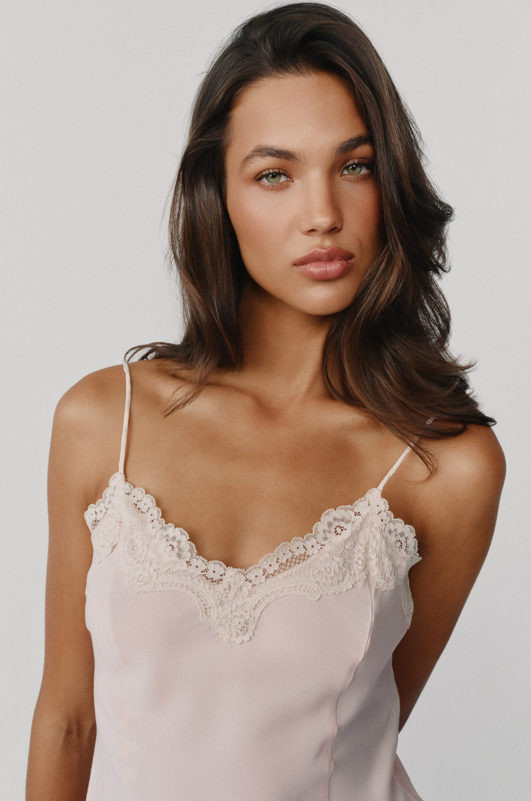 Pink cami-style Emerson top featuring a delicate lace-trim neckline and thin adjustable shoulder straps.