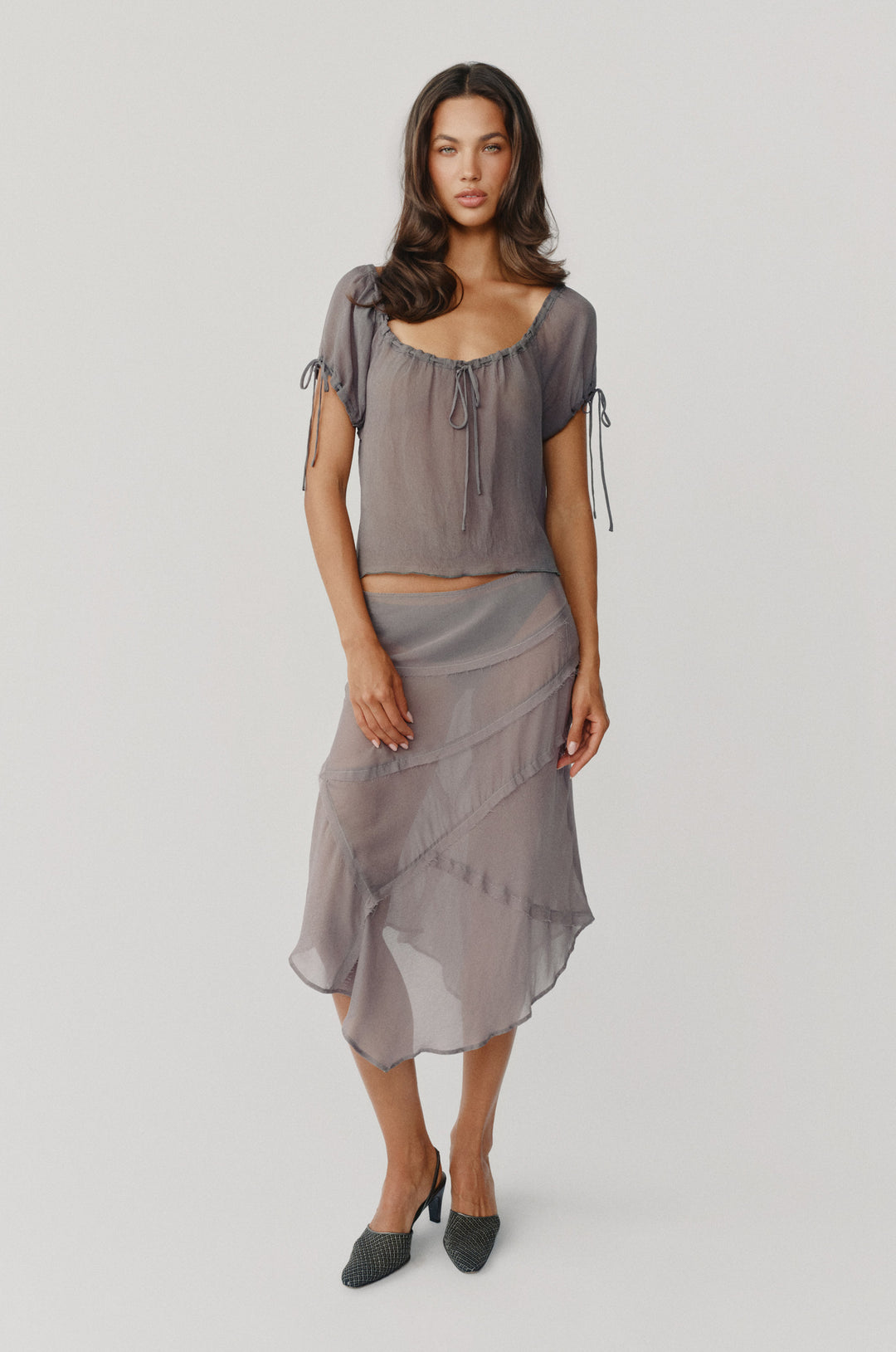 Gia top in ash slate featuring a sheer, relaxed fit with adjustable tie-detail neckline and sleeves.
