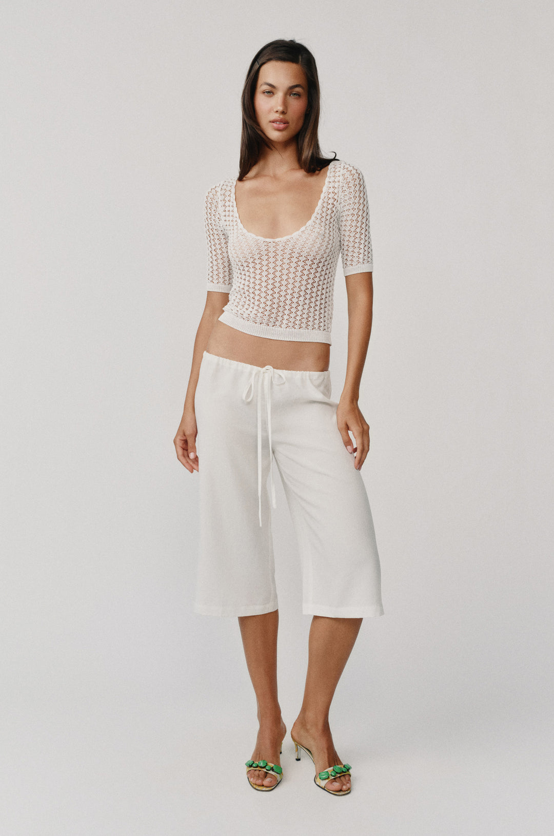 White Harper knitted top with scoop neck, half sleeves, and contrast rib detailing.