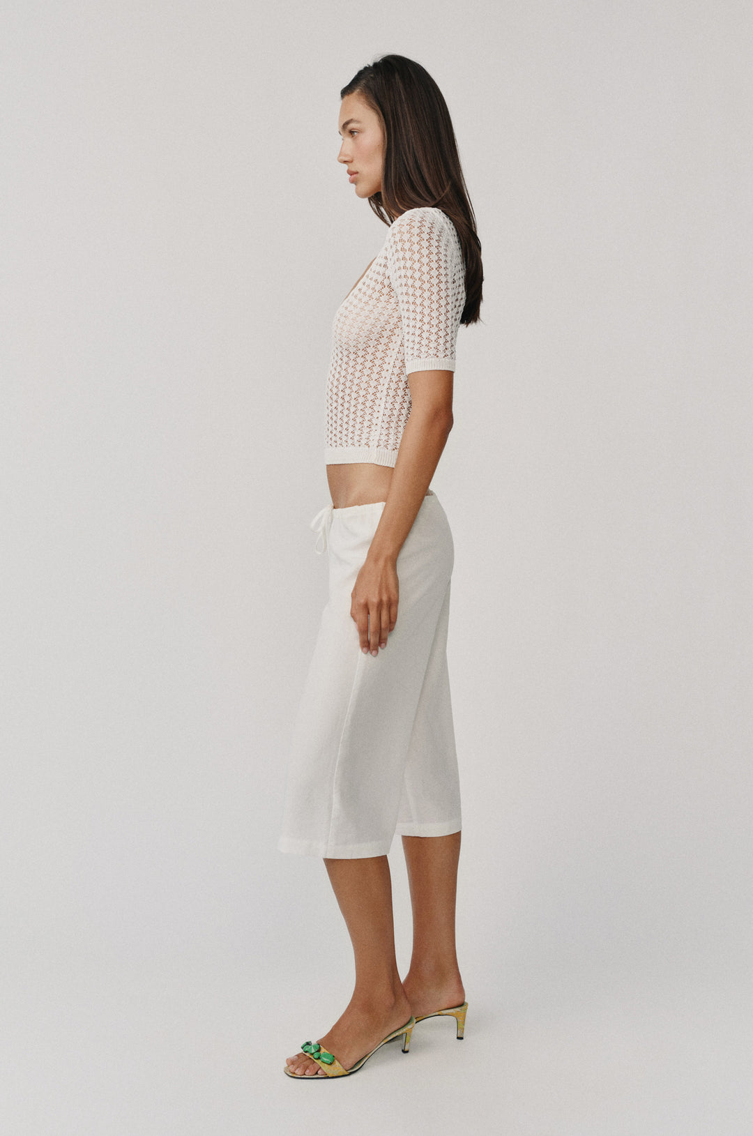 White Harper knitted top with scoop neck, half sleeves, and contrast rib detailing.