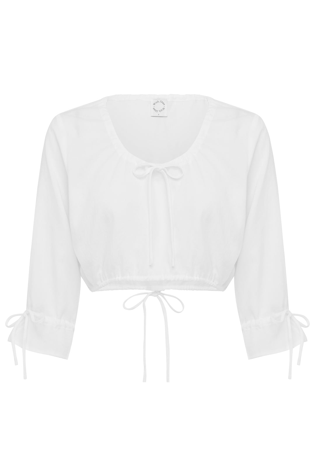 White cropped Maisie top with scoop neckline, tie-front detail, 3/4 sleeves with ruffle cuffs, and drawstring hem.