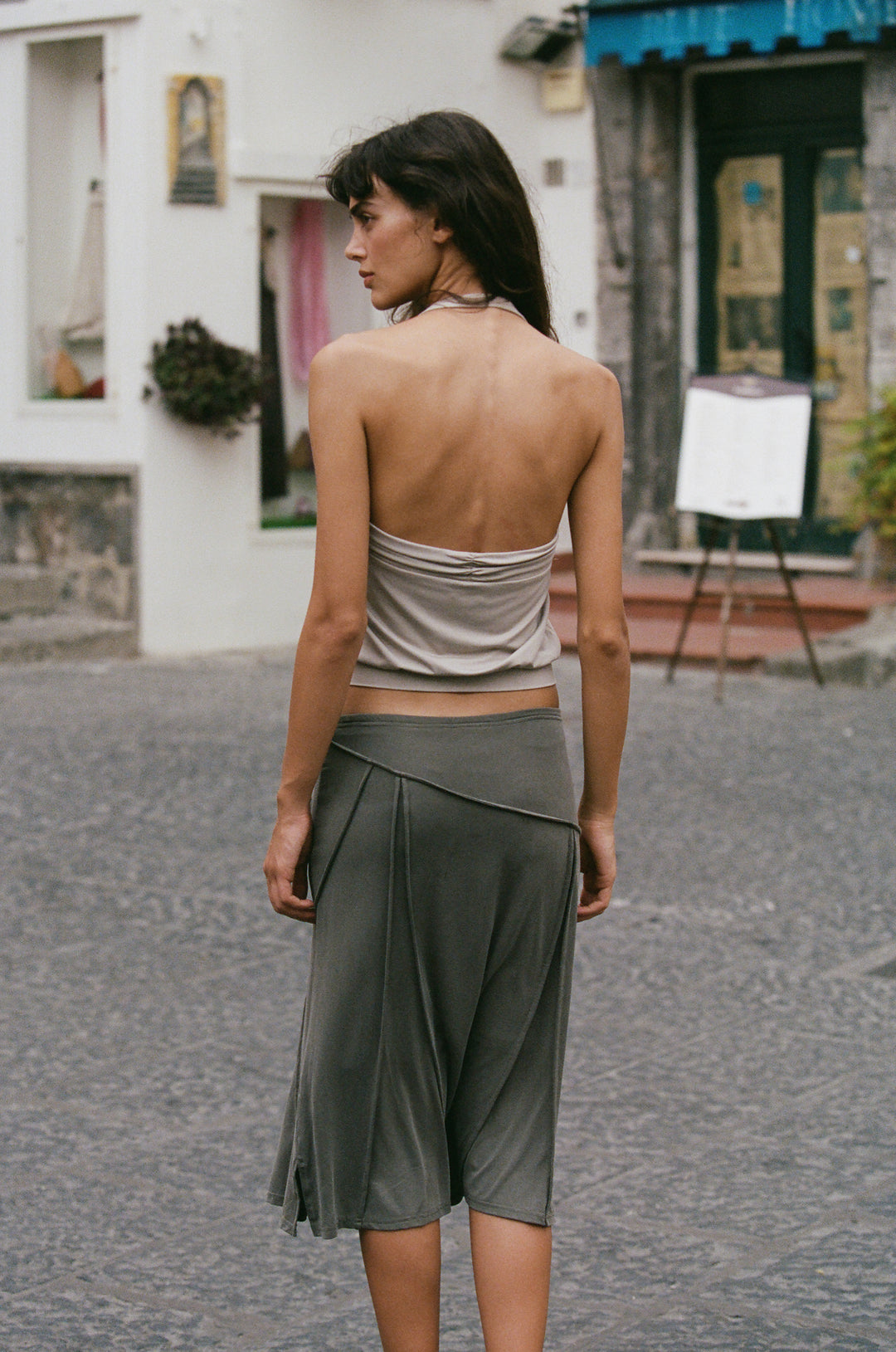 Slate midi-length Scout skirt with an elasticated waistband and asymmetrical seam detailing worn low on the hips.