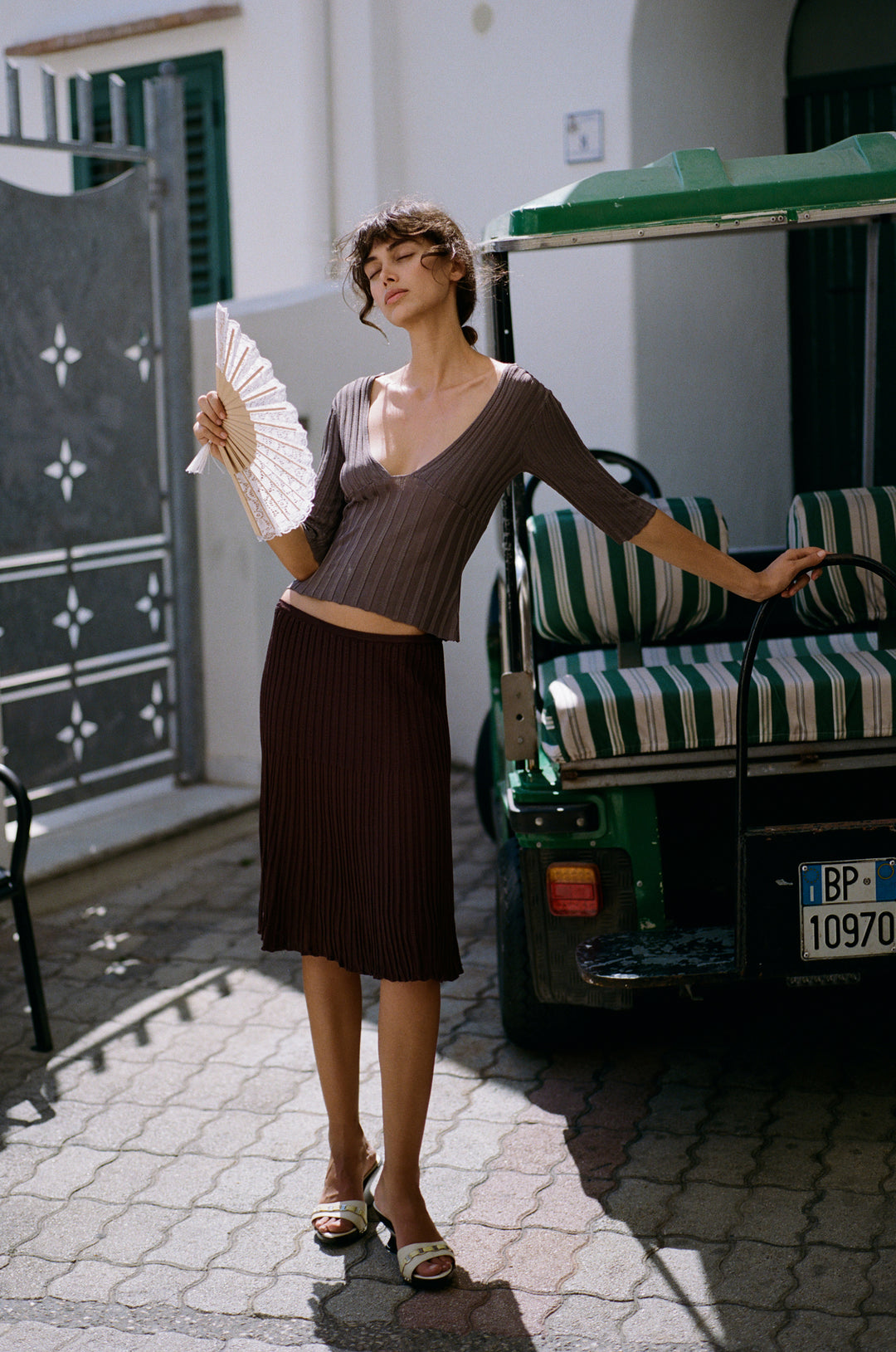 Chocolate brown ribbed-knit midi skirt with an elasticated waistband and contrasting rib detailing.
